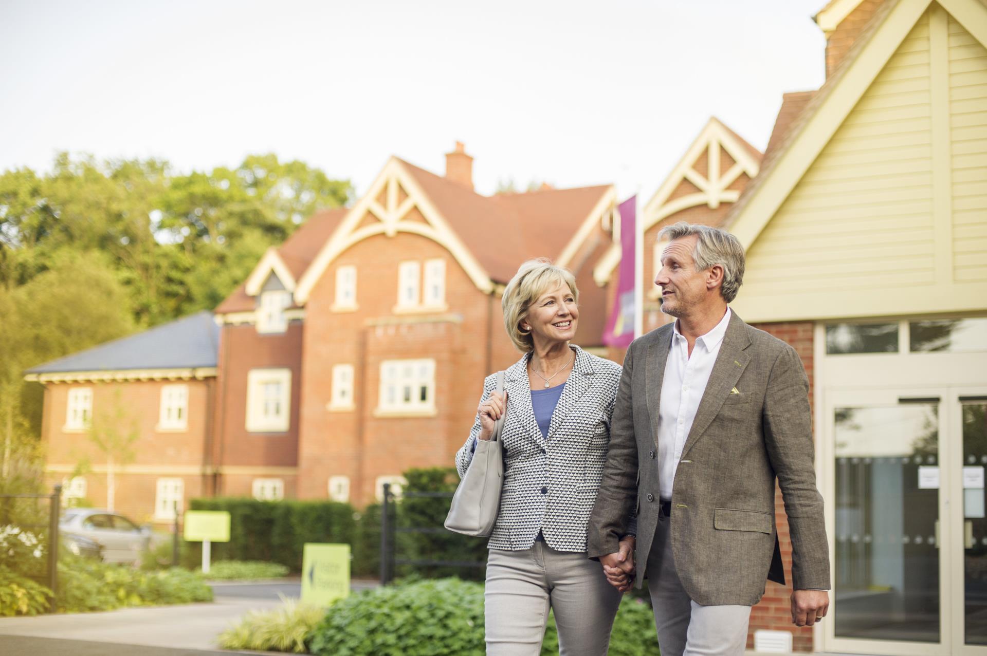 A pair walking near houses